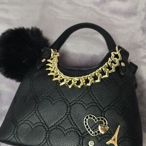 Elegant Black Handbag with Gold Accents